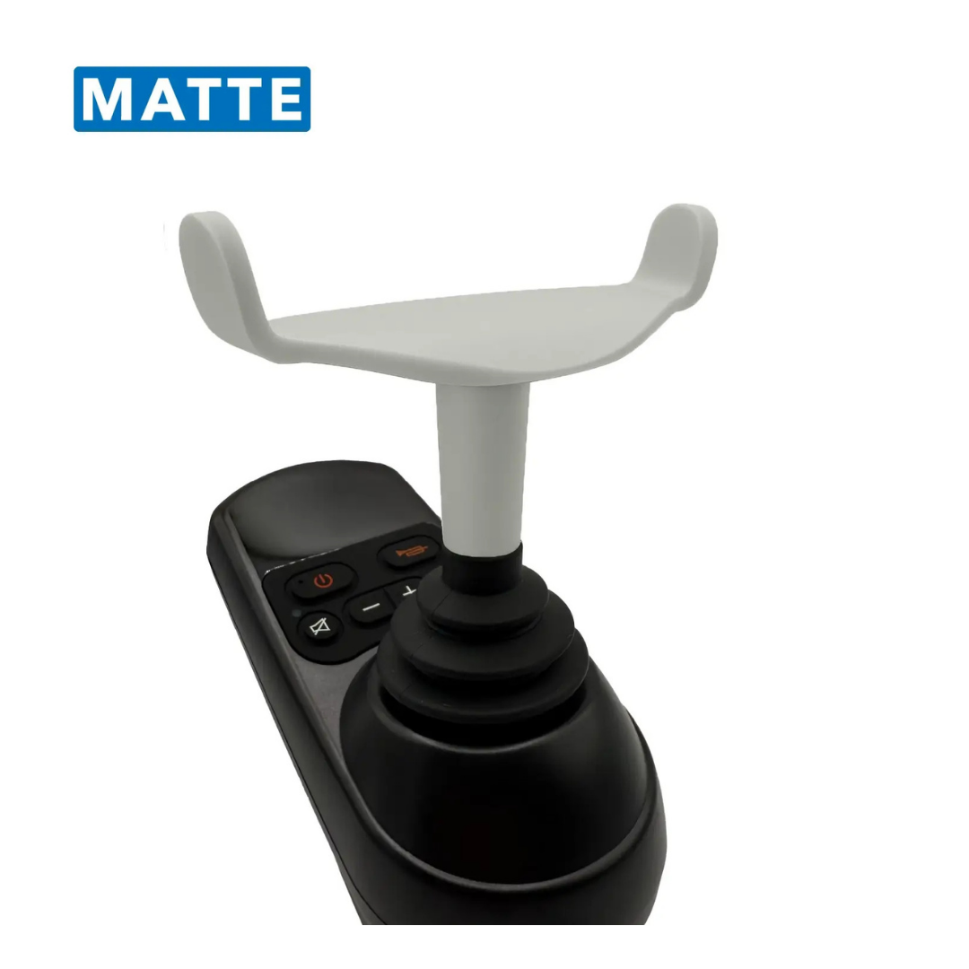 The ComfyGo Ergonomic U-Shaped Joystick Handle with Flex Shaft for Powerchairs features a matte black ergonomic handle with control buttons and a white, U-shaped top attachment. A blue box labeled MATTE appears in the upper left corner.